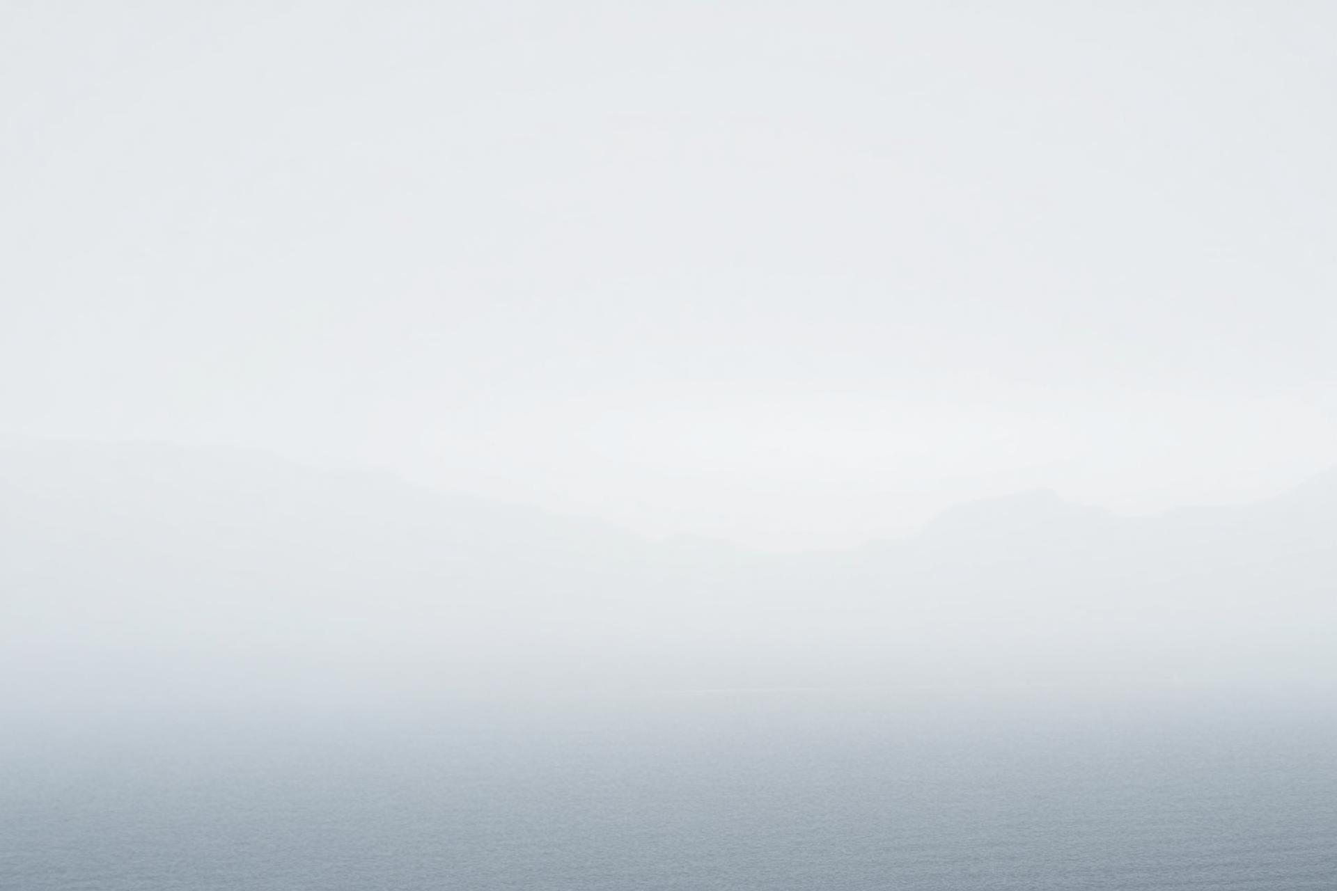 Misty Nordic fjord at dawn